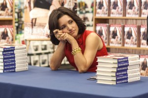 Selina signs her book